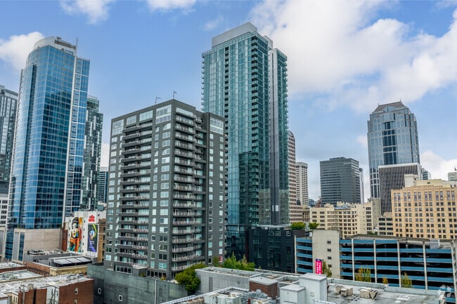 Condos rise above Downtown Seattle with views stretching to the Puget Sound.
