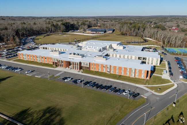 Stretching across vast lawns the Westport Junior/Senior High School is enveloped in green.