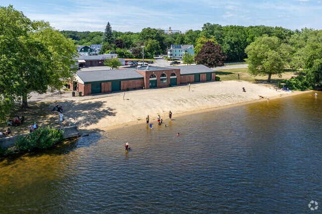 Residents enjoy cooling off in at The Rynne Beach along the Merrimack River in Pawtucketville.