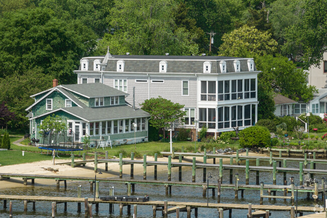 Waterfront estates with large porches line the riverfront in Edgewater.