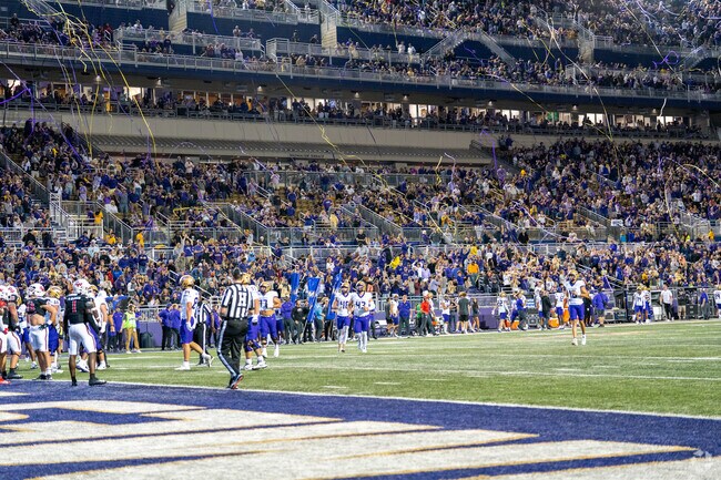 Pleasant Acres locals regularly attend JMU Football games and throw streamers to celebrate.