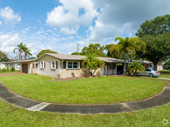 Corner house with a pedestrian walkway.