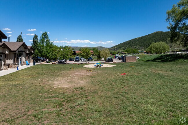 Picnic tables are situated a custom stone patio at The Winter Sports School.