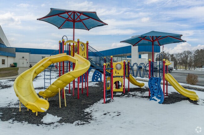 Students play on the jungle gym at recess at Coventry Elementary School.