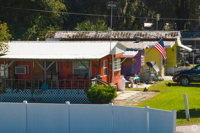Rows of colorful homes line this street in Seville, Florida.