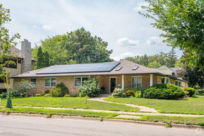 A rambler style house with solar panels in the Linden Hills neighborhood.