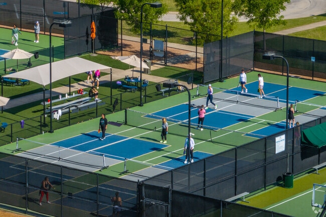 Residents take to the Pickleball courts in The Commons at Windsong Ranch.