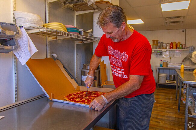 Fresh pizza is prepared at Scotty's Pizza in Waynesburg.