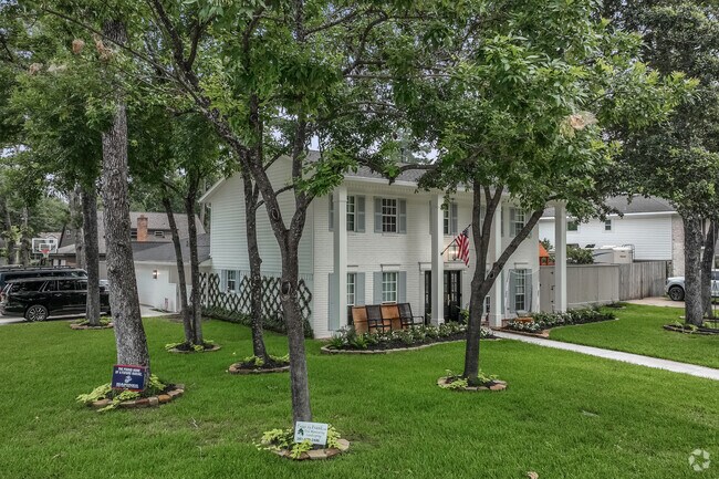 A two-story, Greek Revival home with an oversized lot in Oak Ridge North.