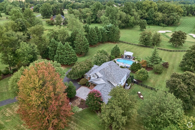 Grand Hickory Grove estates offer privacy with long driveways and expansive acreage.