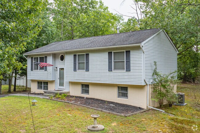 A charming Split-Level home on a sizable lot in Newtonville.