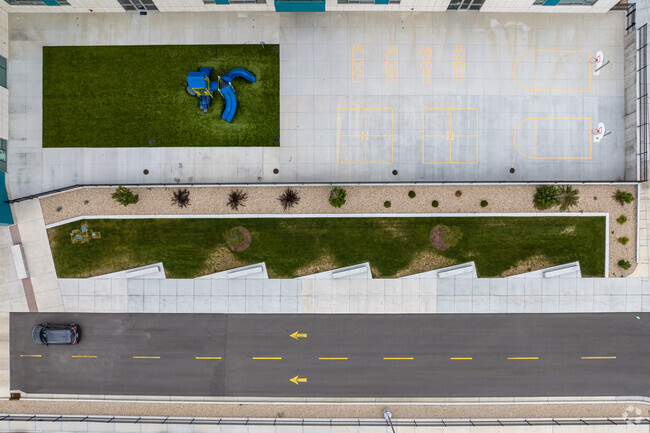 Aerial of a blue playground, basketball hoops and other outdoor activities at Peruvian Park