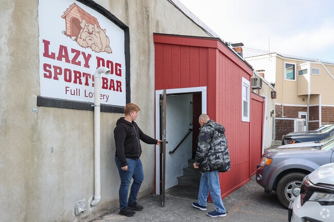 Locals greet each other as they enter the Lazy Dog Pub in Lynn.