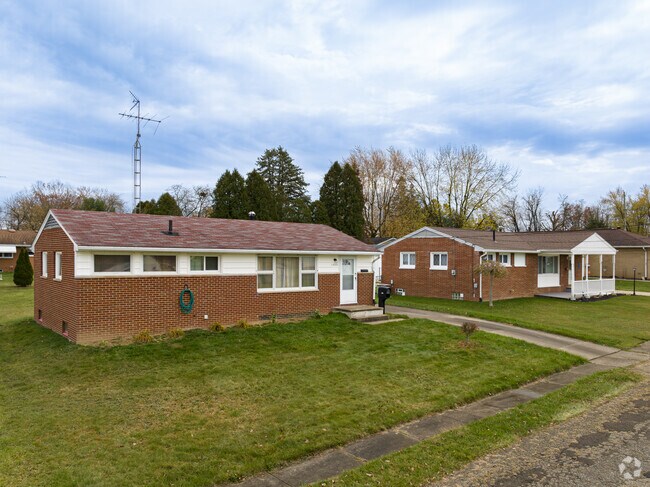 Two brick minimal traditional homes with large yards in Lawndale.