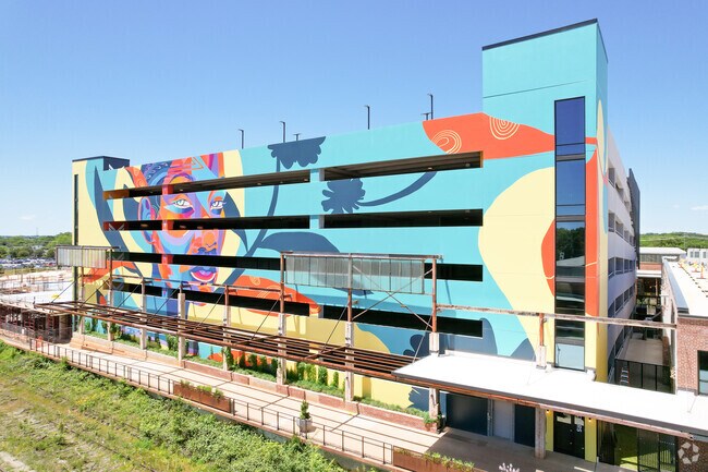 Explore art, food, and shops at Camp North End in Druid Hills near J. T. Williams.