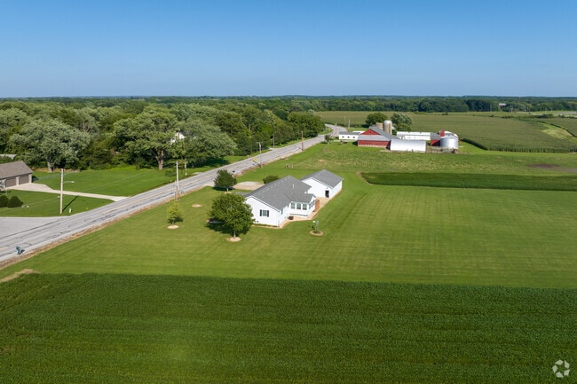 Open farmland with two farmhouses along Old Lincoln Highway in Deep Run, Merrillville.