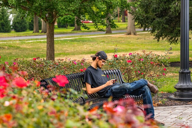 A student enjoys the well-maintained garden areas at Thaddeus Stevens College of Technology.