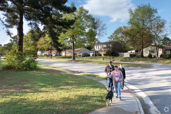 Residents enjoy walking their dogs through the quiet, tree-lined streets of Charlestowne.