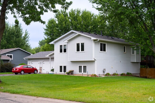 Single-family home with a yard on a curving Centerville street.