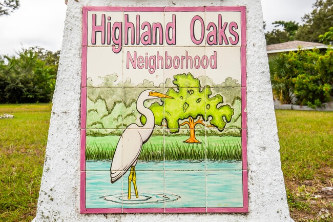 Beautiful old signage welcomes visitors and residents to Highland Oaks.
