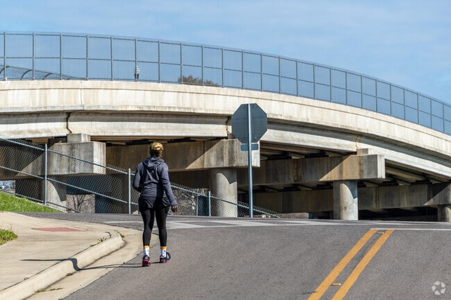 A woman walking around Maclin Park.