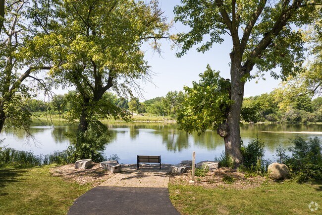 A scenic bench in Oswego overlooking the Fox River.