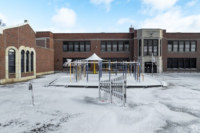 The building for Harry St Elementary is made of red brick.