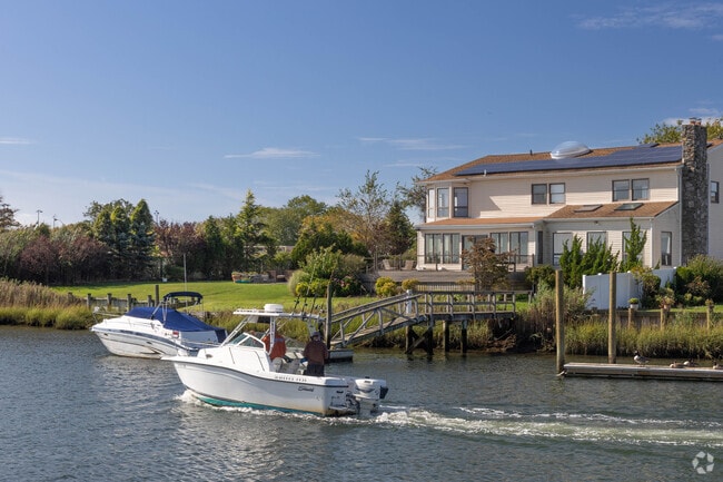 Many homes in Oceanside have docks with boats on the various canals.