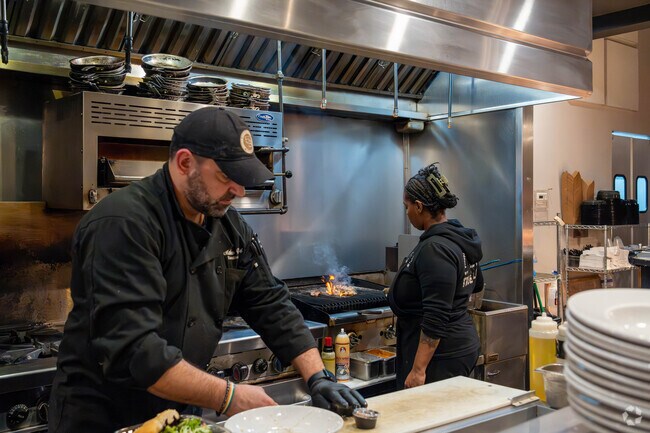 Sit at the bar and watch the chefs prepare your food at 56 Kitchen in Solon.