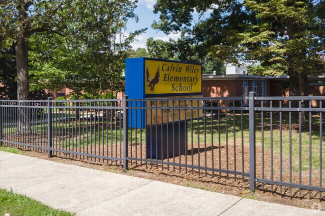 The plaque at the entrance to Calvin Wiley Elementary School