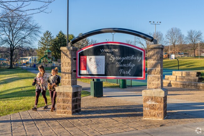 At Springettsburg Township Park, mothers take their children to the exciting playground.