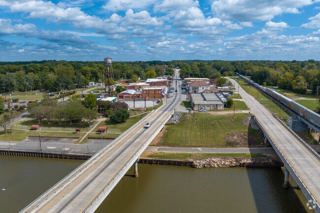 The Dennis Freeman Memorial River Park is close to industrial buildings near the Sabine River.