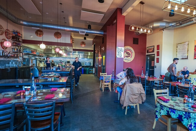 Friends of the Golden Gate neighborhood enjoy their meal at Cafe Colucci.