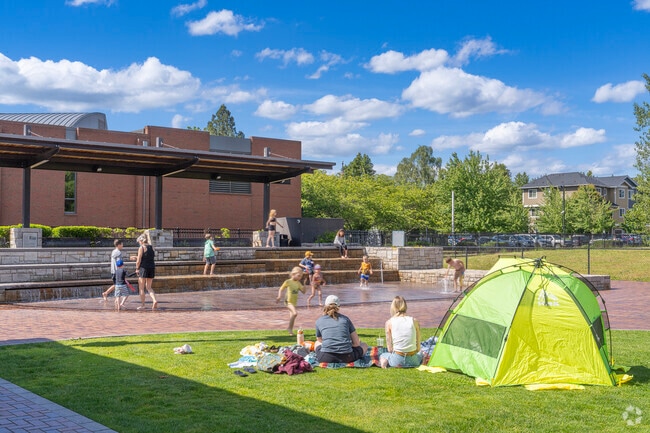 Families make a splash at Cannery Square on a sunny summer day in Sherwood.