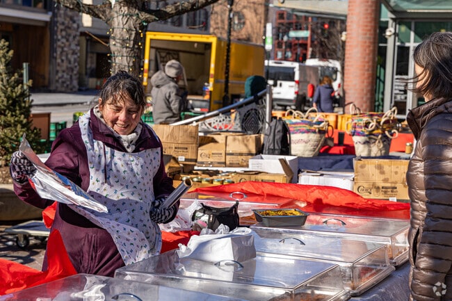 Vendors serve with a smile regardless of the cold at the Princeton Farmers Market.
