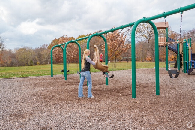 Kids feel like super heroes while riding the swings at Southeastway Park near Acton.