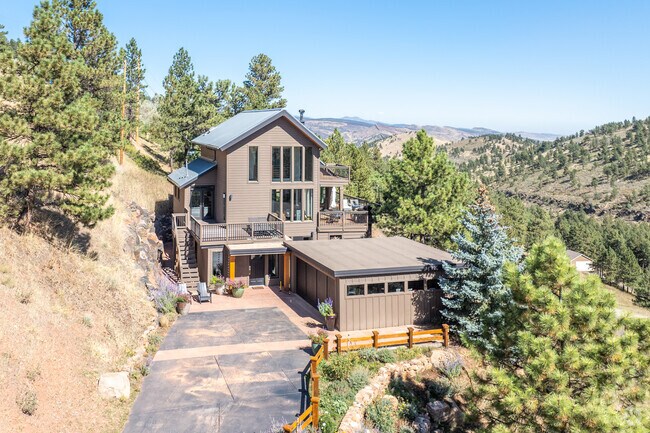 Charming cabin-style architecture meets modern design in the picturesque Foothills.