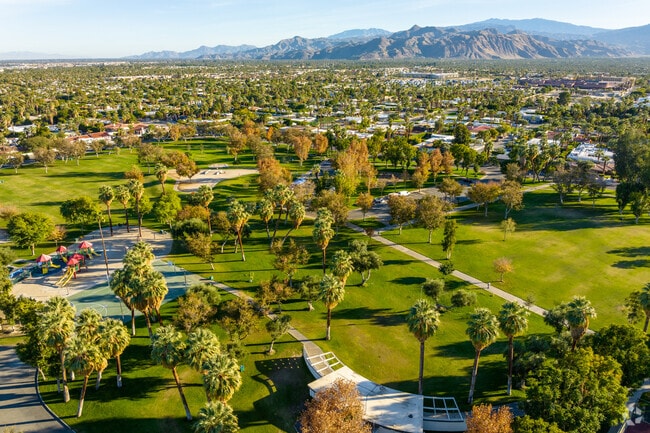 Oasis del Sol is surrounded by towering mountains and lush green parks,