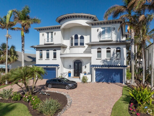 Grand homes replace the small mid-century homes that once lined the shores of Vanderbilt Beach.