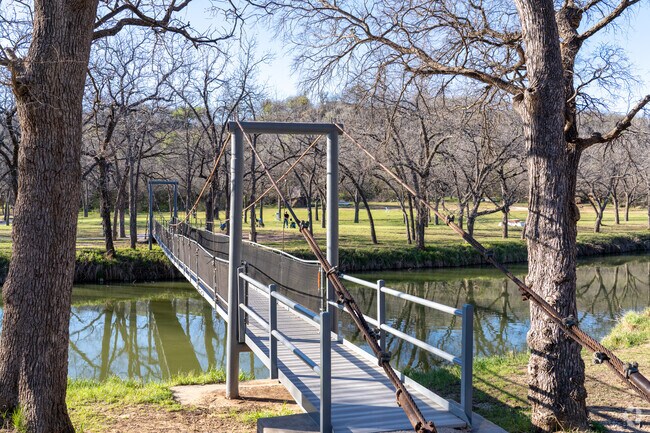 The scenic bridge stretches across the river, offering a peaceful view in Graham.