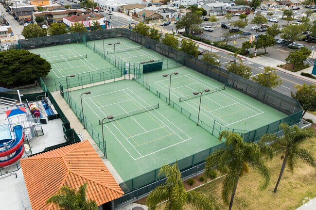Residents frequent the tennis courts at City Heights Urban Village.