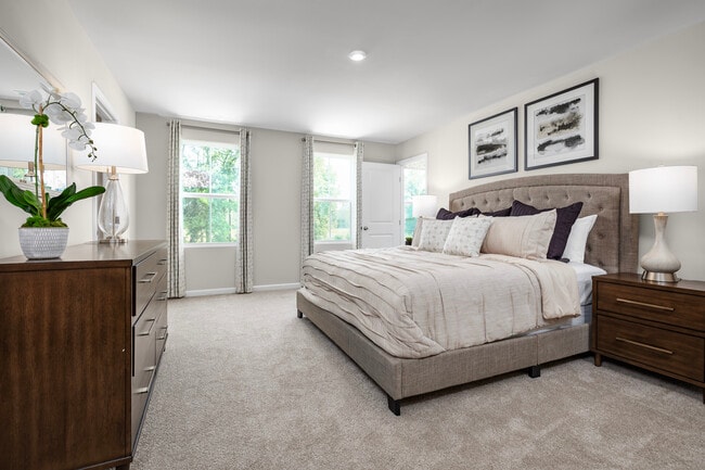 Mornings are a breeze in your spacious owner's suite featuring up to 2 walk-in closets! Your laundry room is also just steps away from your bedroom, making laundry day effortless—Plan your visit!