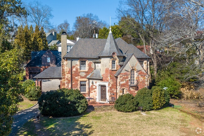 A brick and stone Queen Anne style home in the Redmont Park neighborhood.