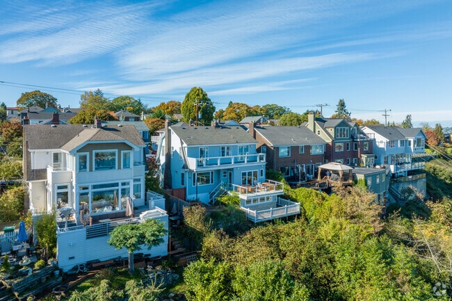 Homes on Taylor Avenue in North Queen Anne boast decks with city and mountain views.