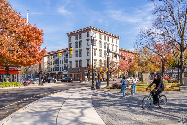 Walkers and bikers enjoy the wide sidewalks of downtown Easton.
