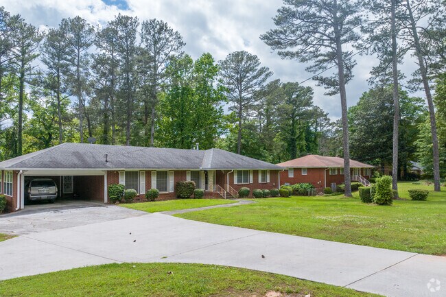 Classic brick ranch homes in West Manor showcases the neighborhood's hallmark features such as spacious living, manicured lawns, and quiet tree-lined settings that offer both privacy and suburban charm.