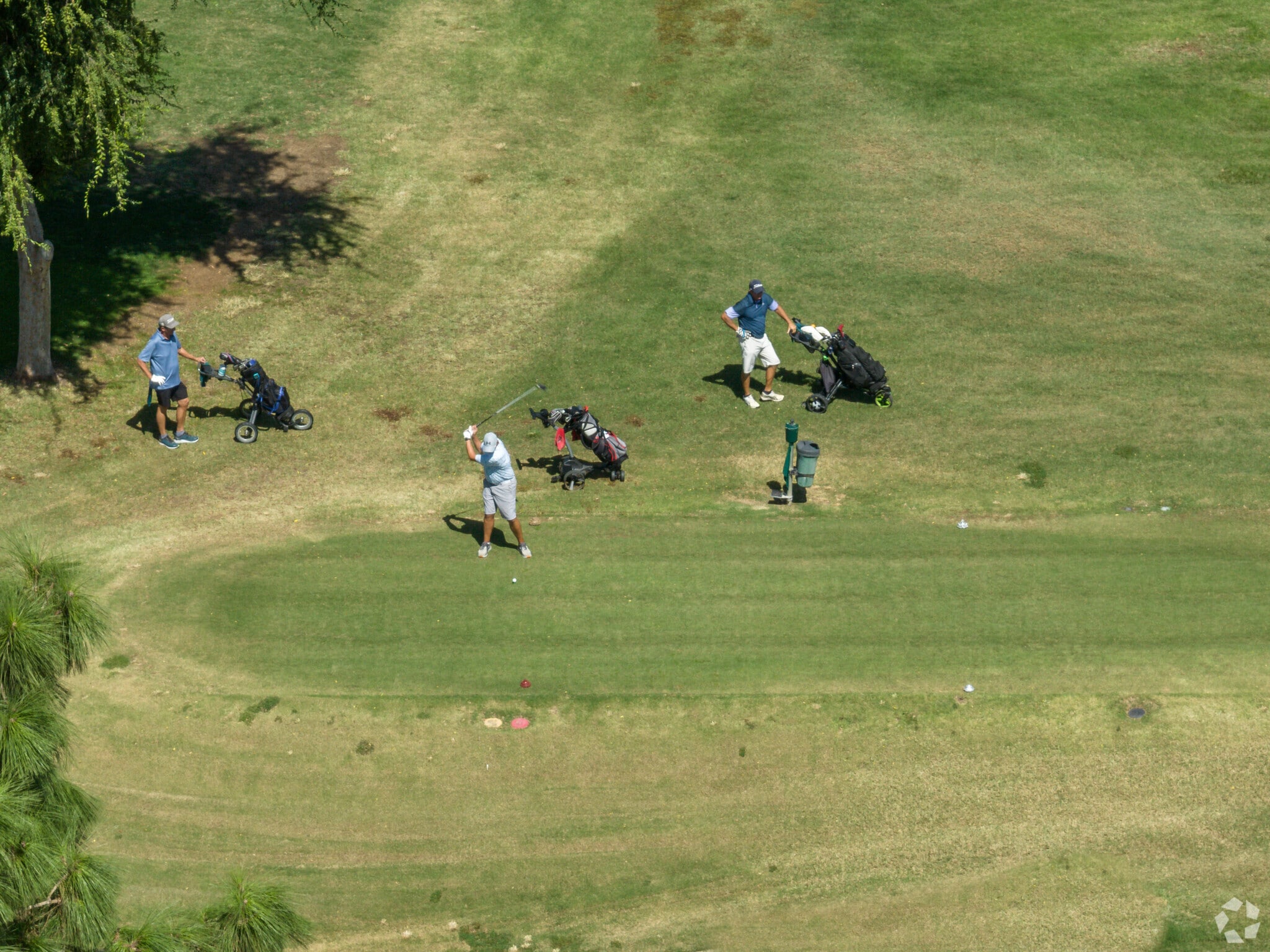 A golfer hits his ball down the fairway at the Bakersfield Country Club.