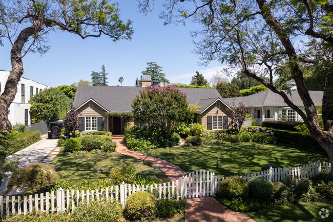 Quaint cottage in Sherman Oaks: A white picket dream with a lush front yard oasis.
