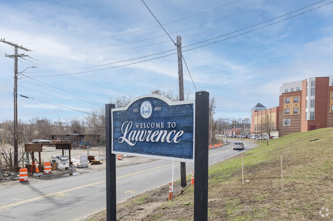 A Welcome to Lawrence sign greets visitors with pride, reflecting the city's heritage and hospitality.