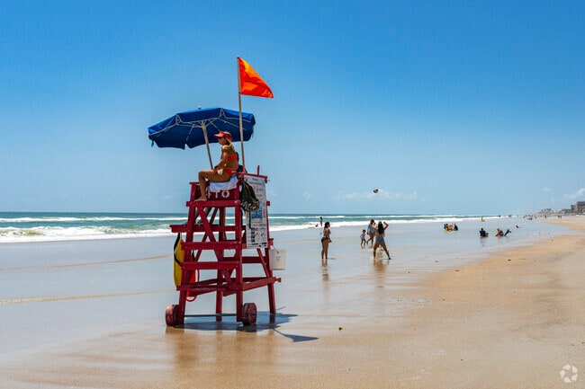 Swim near the life guard or play volleyball with friends on the sandy shores of Coronado Beach.